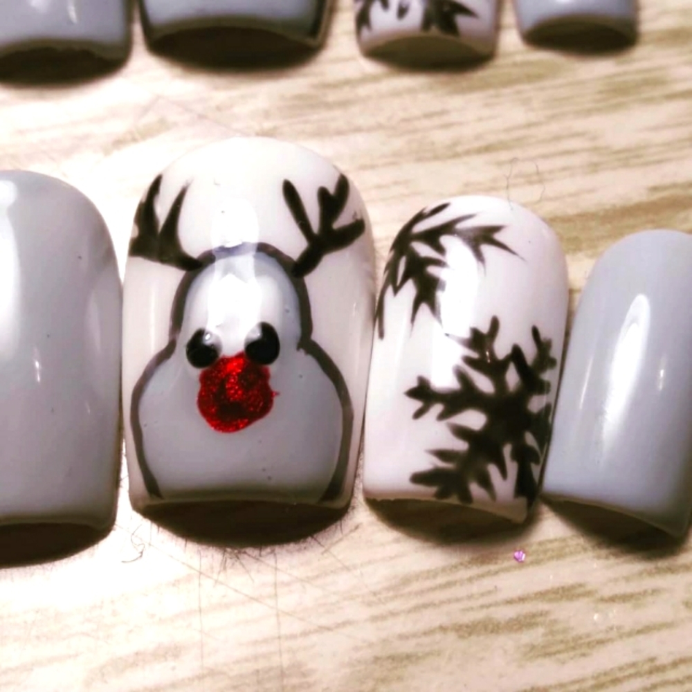 Press on nails  Rudolph red nose, snowflakes.